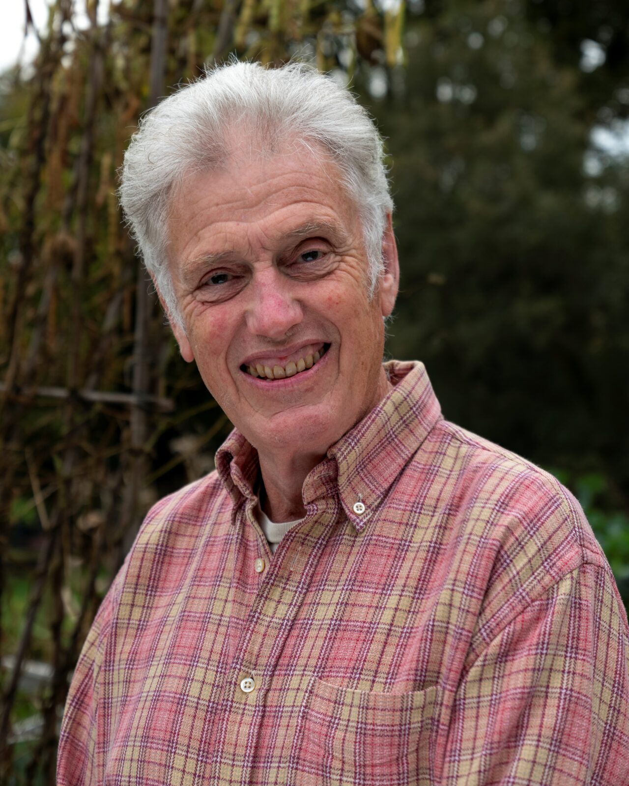 A man smiles to camera.