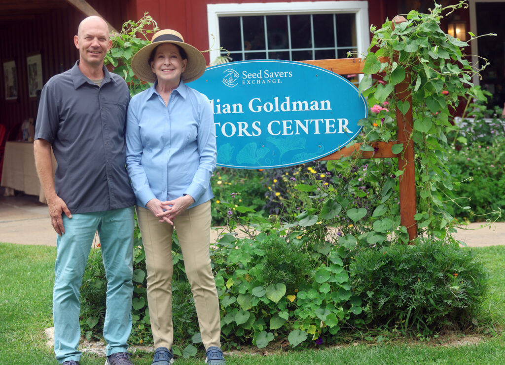 Mike Bollinger and Amy Goldman Fowler pose outside the Lillian Goldman Visitors Center at Heritage Farm during the 50th-anniversary celebration.